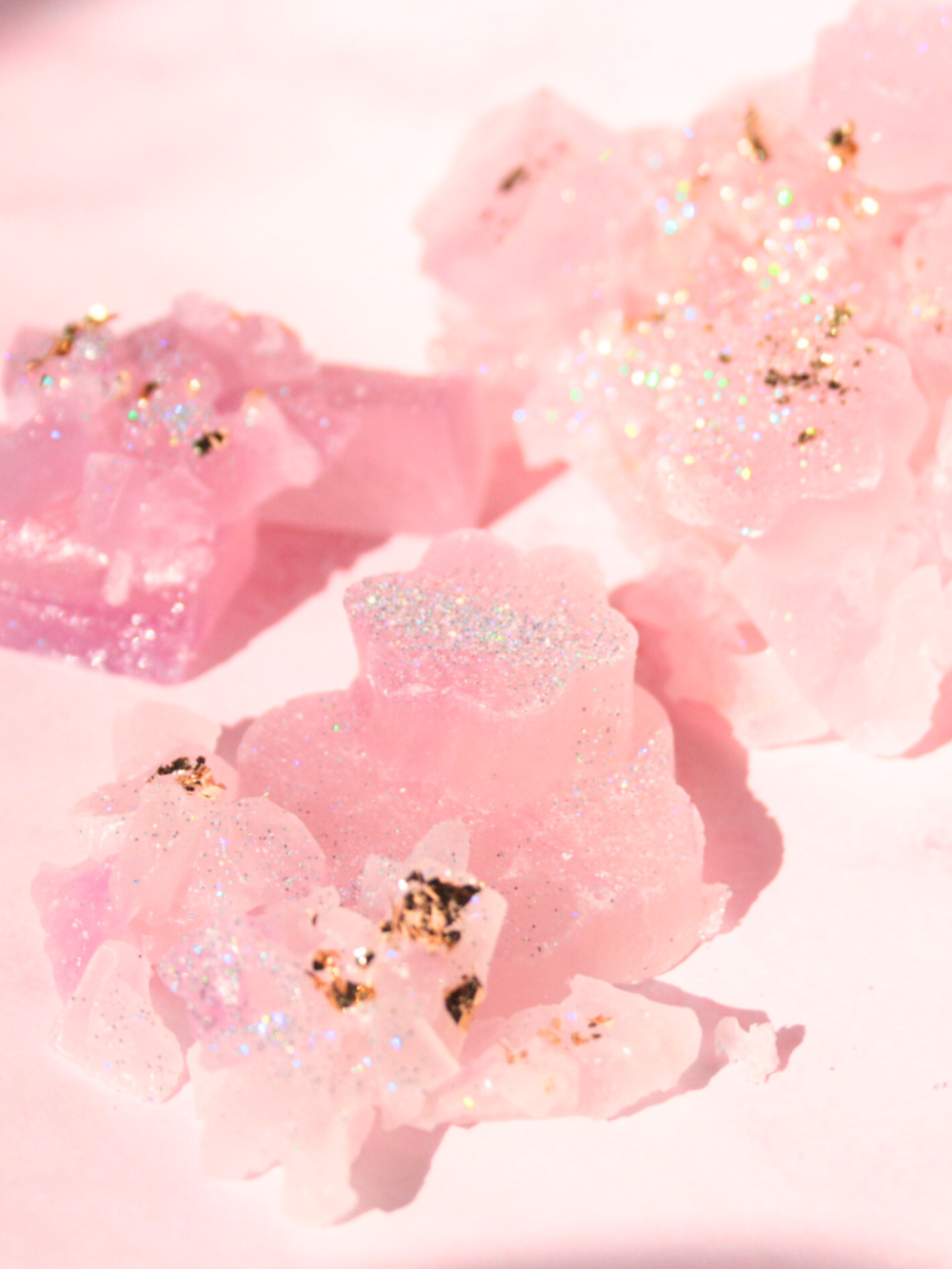 AVEORA logo – crystal candy wellness supplements glitter gold lilac